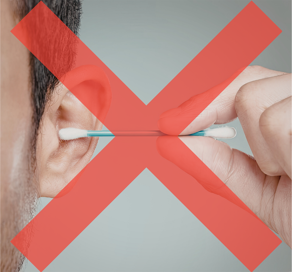 Close-up of a person’s ear with a cotton swab near the ear canal, overlaid by a red X indicating this is not advised.